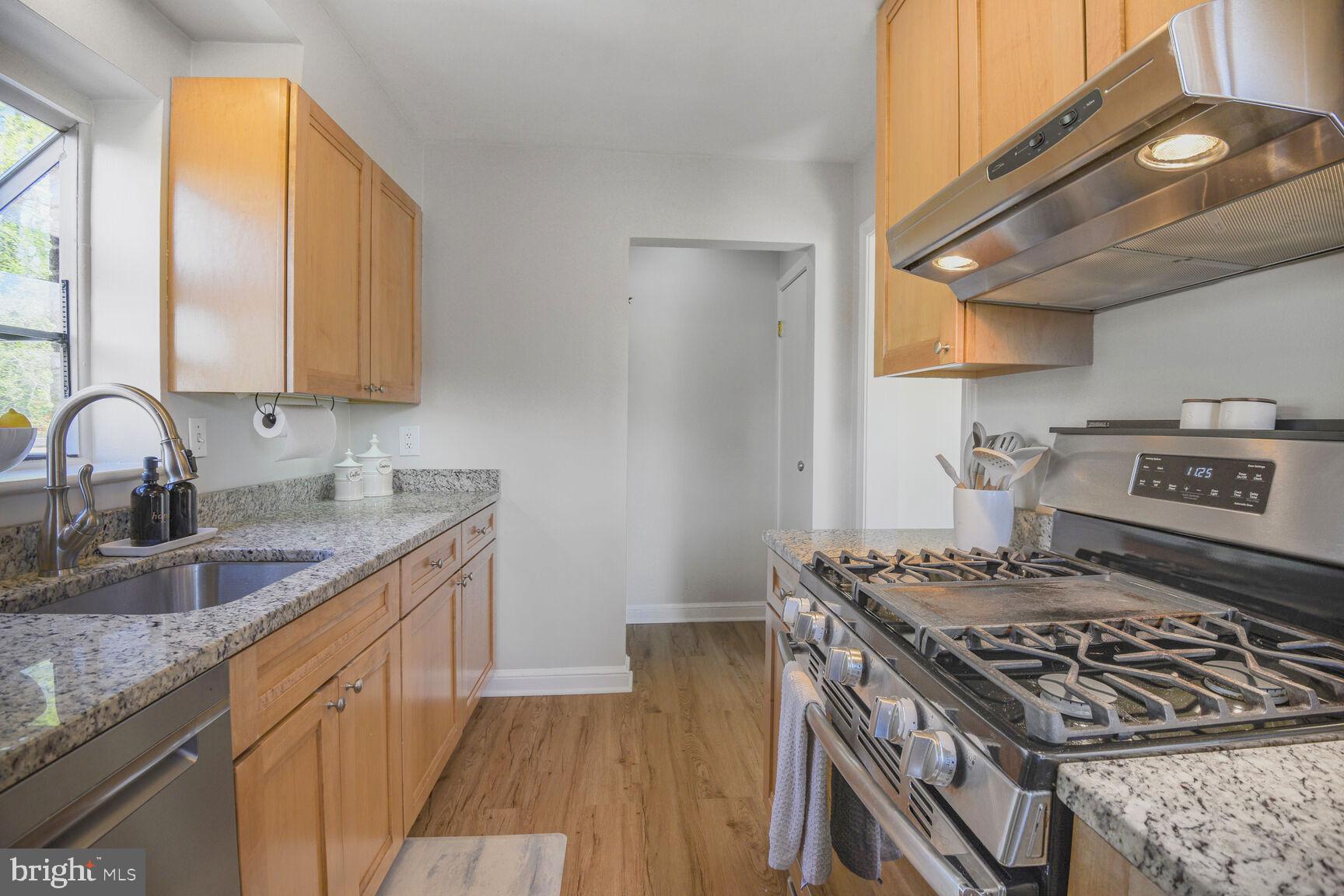10002 Reddick Drive Silver Spring, MD 20901 - Photo 12 of 33 a kitchen with a stove and a sink