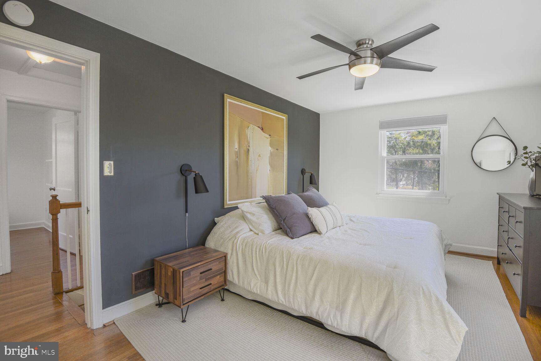 10002 Reddick Drive Silver Spring, MD 20901 - Photo 17 of 33 a bedroom with a large bed and a window
