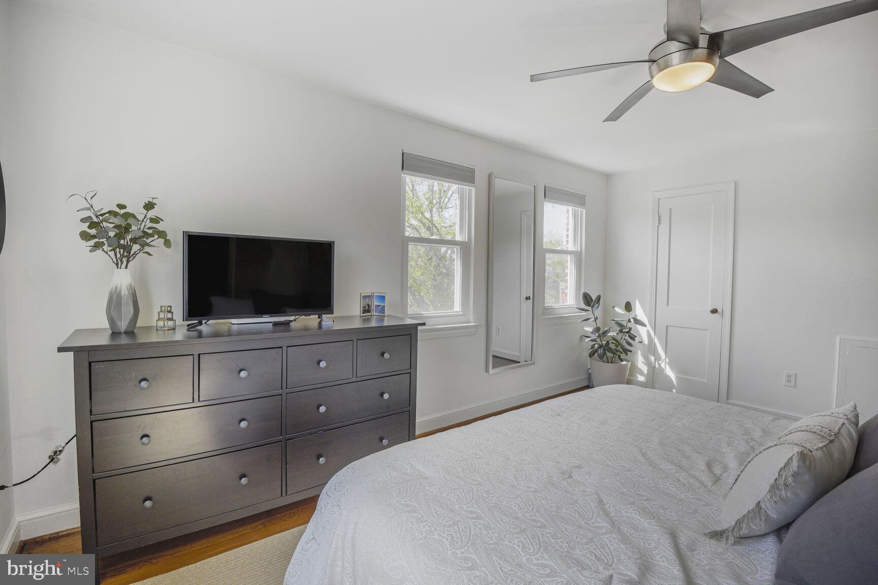 10002 Reddick Drive Silver Spring, MD 20901 - Photo 18 of 33 a bedroom with a bed and a flat screen tv