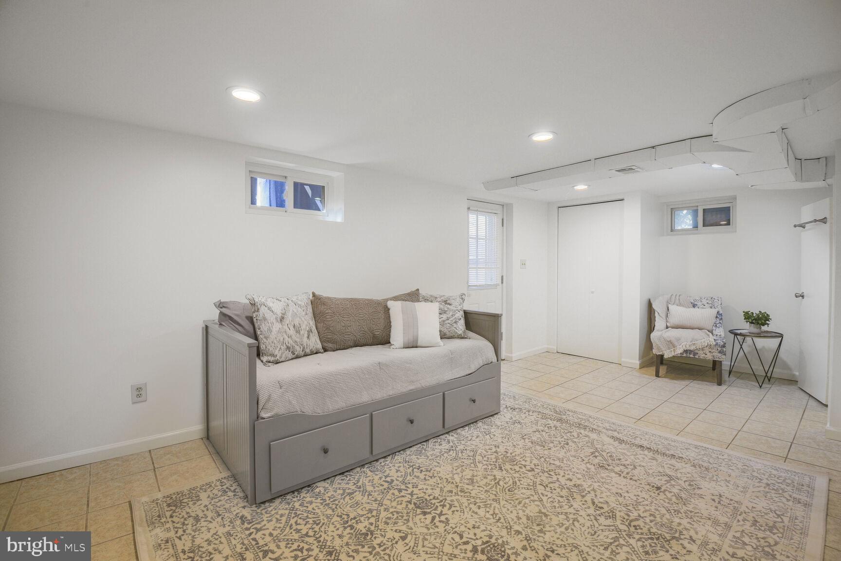 10002 Reddick Drive Silver Spring, MD 20901 - Photo 24 of 33 a living room with furniture and a rug