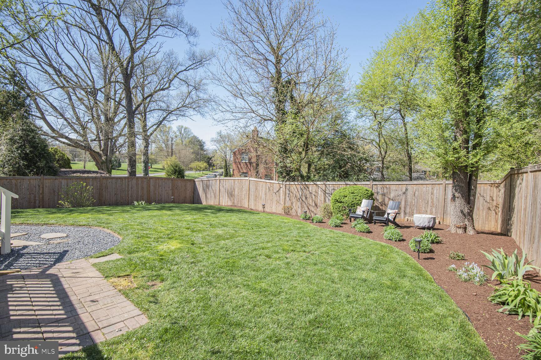 10002 Reddick Drive Silver Spring, MD 20901 - Photo 29 of 33 a backyard of a house with table and chairs