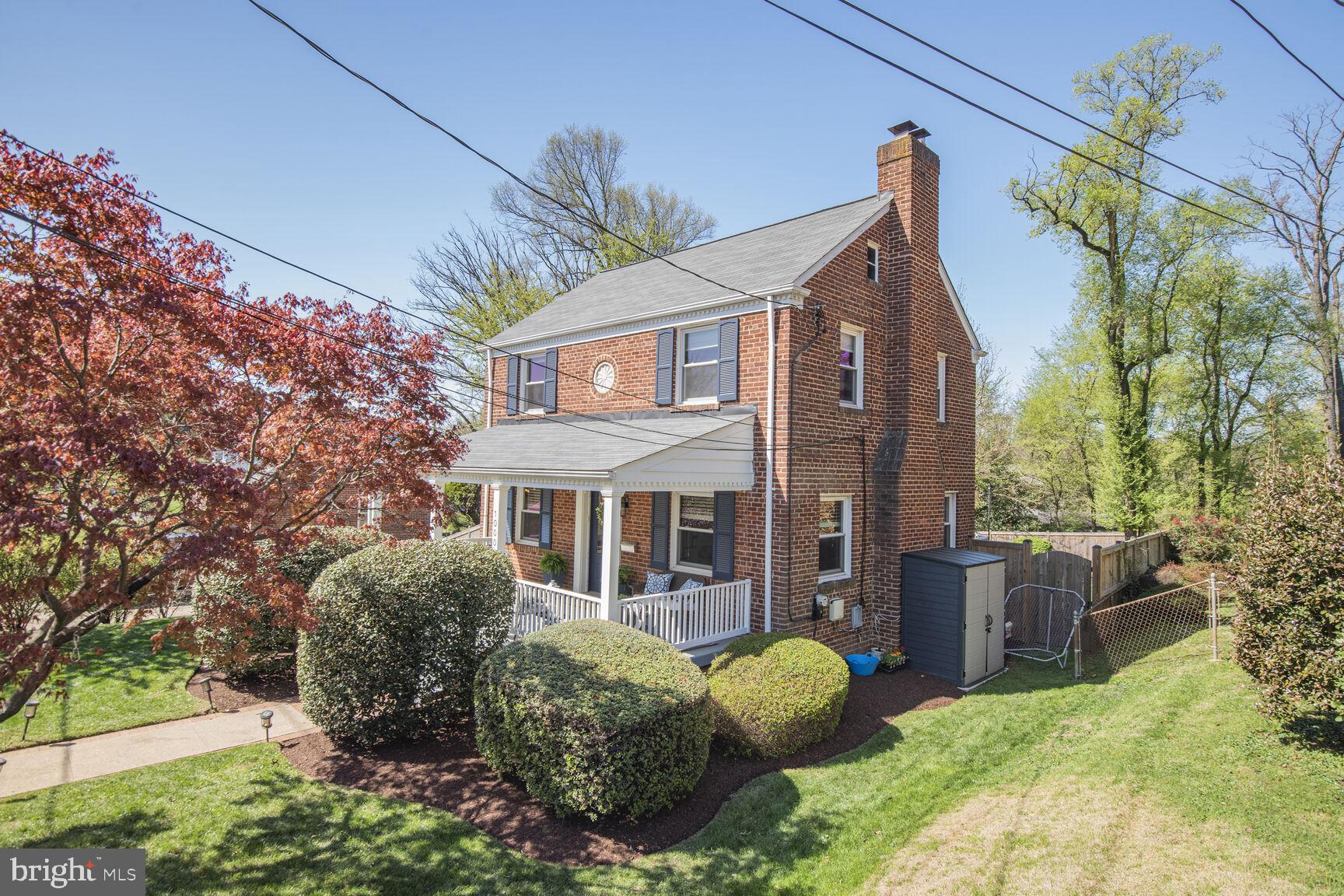 10002 Reddick Drive Silver Spring, MD 20901 - Photo 33 of 33 a view of a house with brick walls and a tree