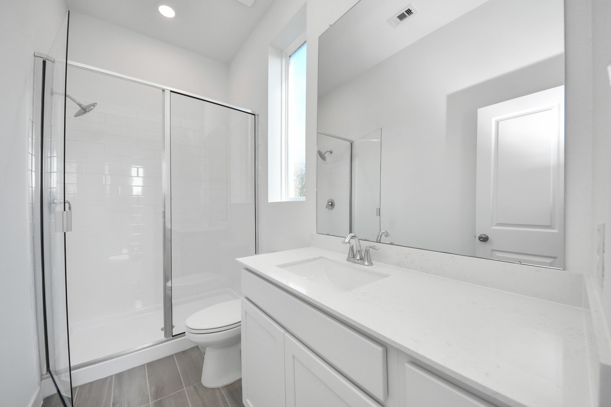 27111 Blue Pool Drive Katy, TX 77493 - Photo 18 of 38 a bathroom with a shower sink vanity and toilet