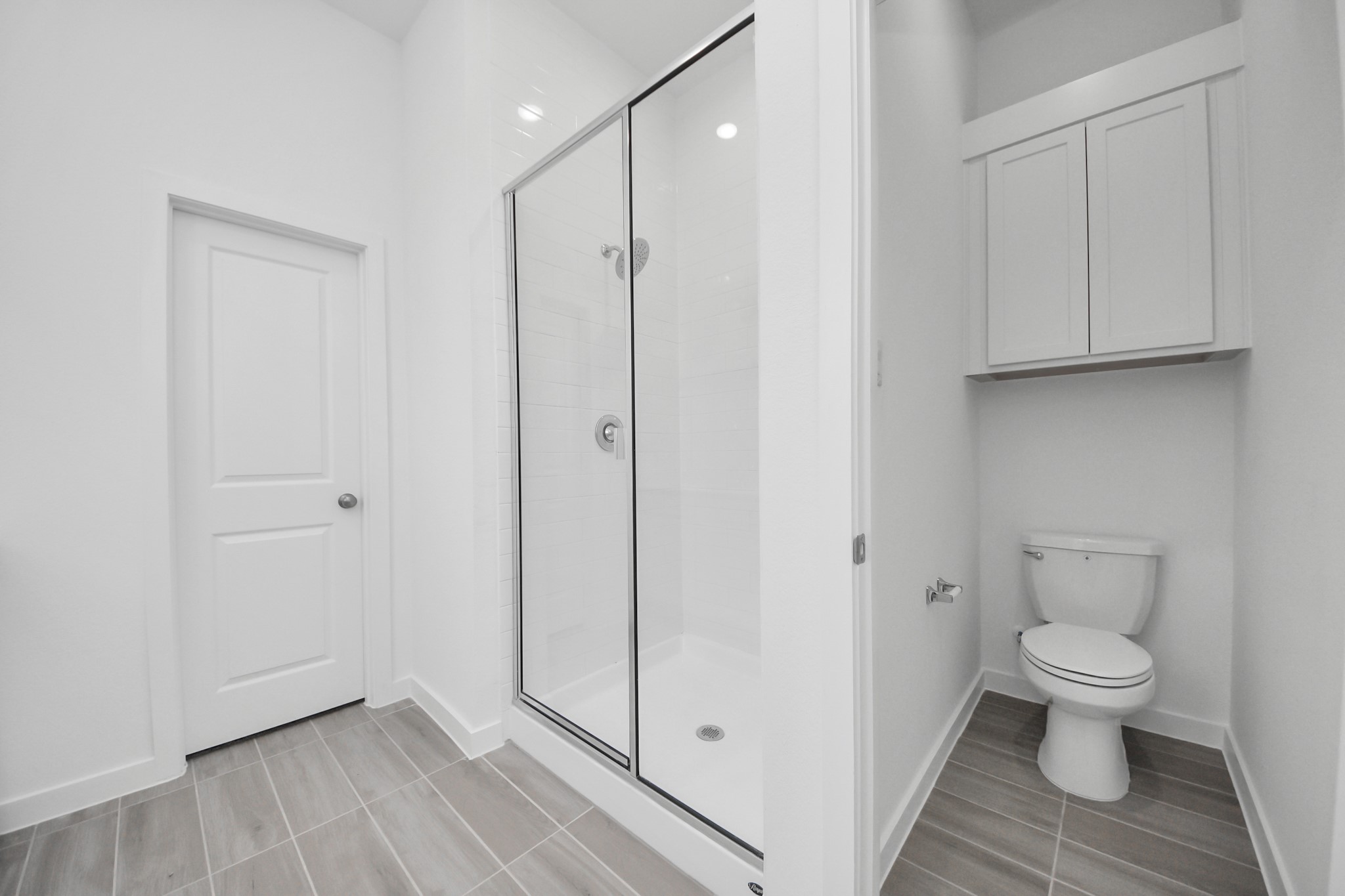 27111 Blue Pool Drive Katy, TX 77493 - Photo 21 of 38 a bathroom view of a toilet and a hardwood