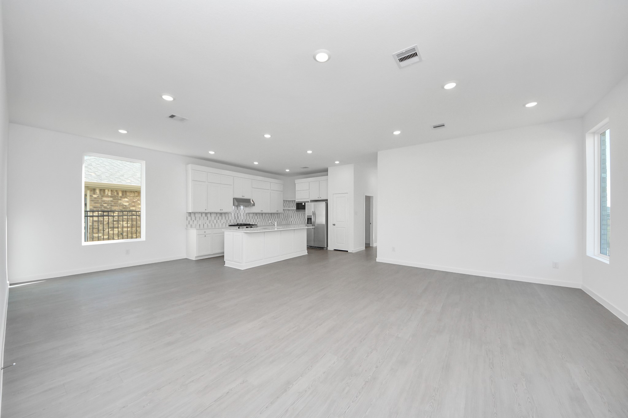 27111 Blue Pool Drive Katy, TX 77493 - Photo 5 of 38 a view of a kitchen with white cabinets