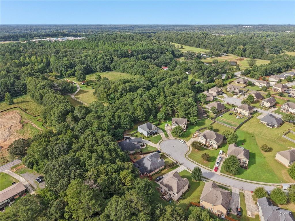 115 Tanners Court Covington, GA 30016 - Photo 11 of 60 an aerial view of a house with a yard
