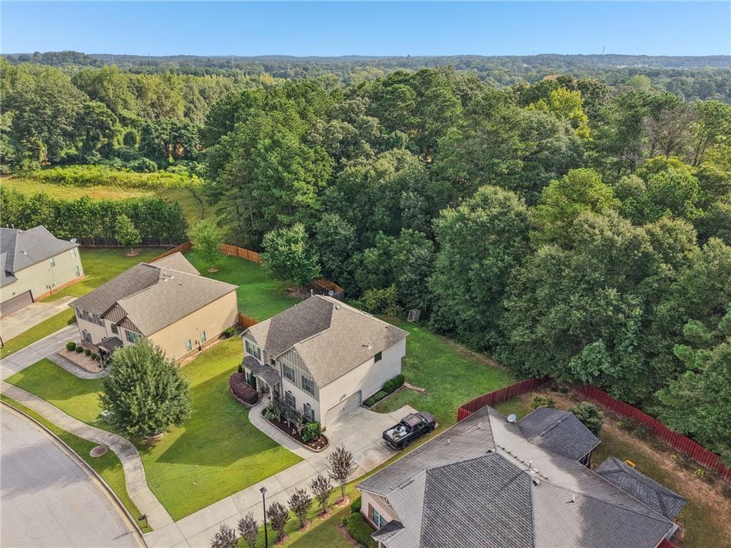 115 Tanners Court Covington, GA 30016 - Photo 19 of 60 an aerial view of a house with a yard