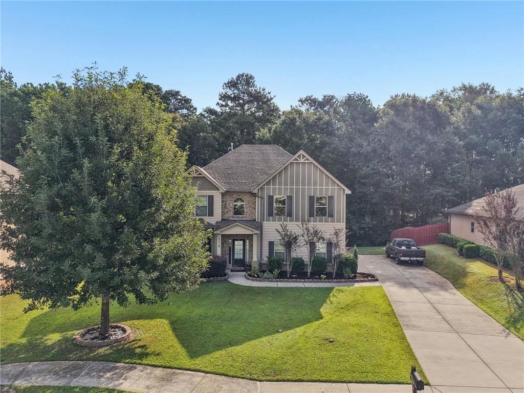 115 Tanners Court Covington, GA 30016 - Photo 22 of 60 a front view of a house with a yard