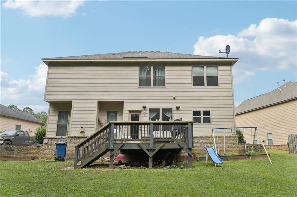 115 Tanners Court Covington, GA 30016 - Photo 26 of 60 a view of a house with a yard