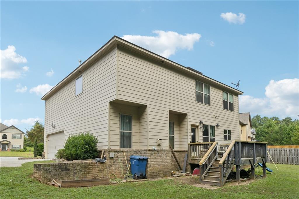 115 Tanners Court Covington, GA 30016 - Photo 27 of 60 a front view of a house with a yard