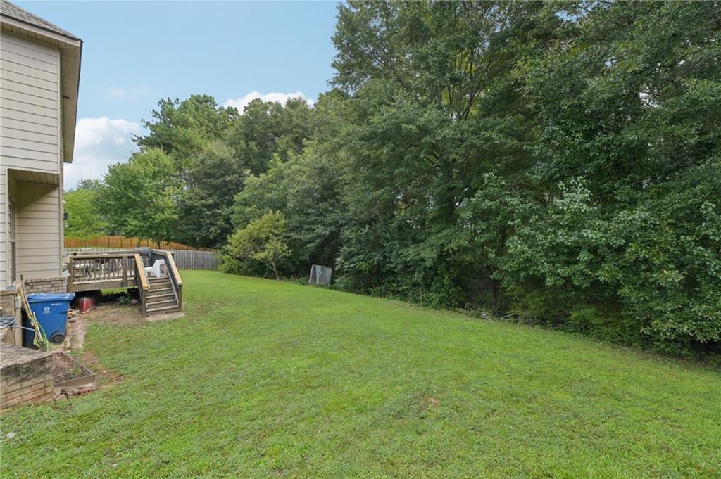 115 Tanners Court Covington, GA 30016 - Photo 28 of 60 a view of a backyard with sitting area