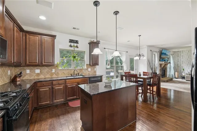 a living room with furniture and a painting
