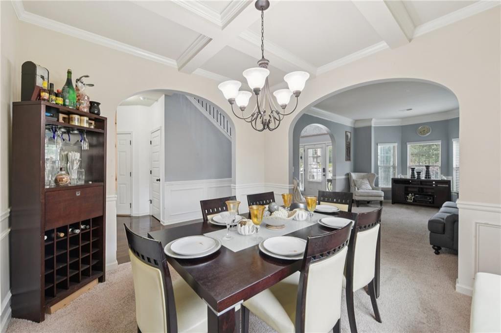 115 Tanners Court Covington, GA 30016 - Photo 46 of 60 a view of a dining room with furniture and chandelier