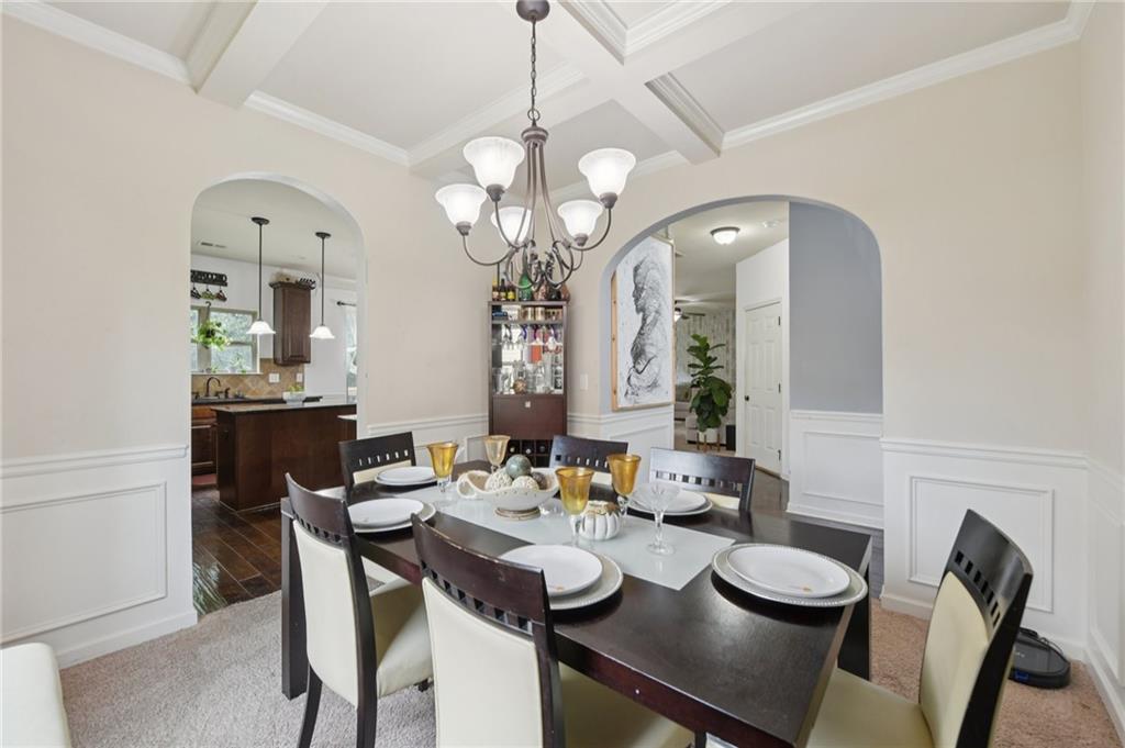 115 Tanners Court Covington, GA 30016 - Photo 47 of 60 a view of a dining room with furniture and a chandelier
