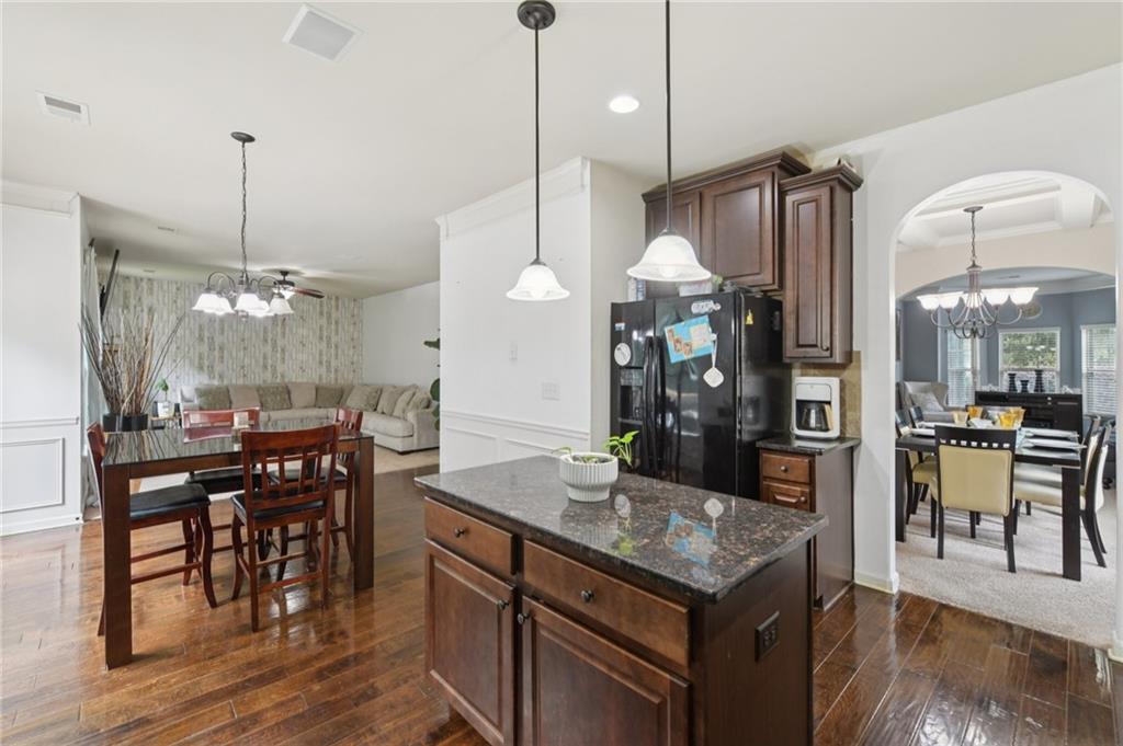 115 Tanners Court Covington, GA 30016 - Photo 49 of 60 a kitchen with a table and chairs in it
