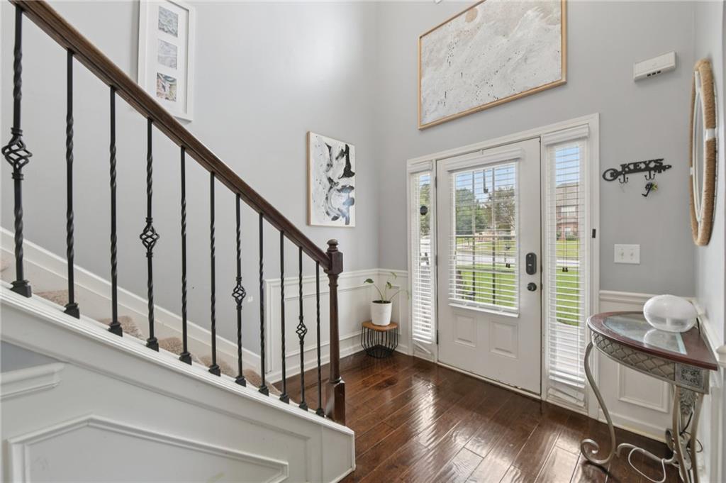 115 Tanners Court Covington, GA 30016 - Photo 57 of 60 a view of an entryway with wooden floor and windows