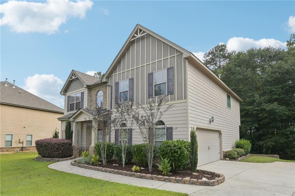 115 Tanners Court Covington, GA 30016 - Photo 59 of 60 a front view of a house with garden