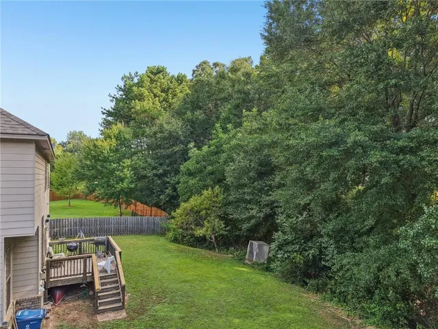 an aerial view of residential house with outdoor space
