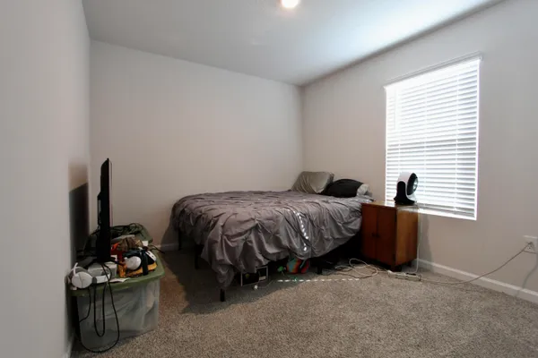 a bedroom with a bed and a closet