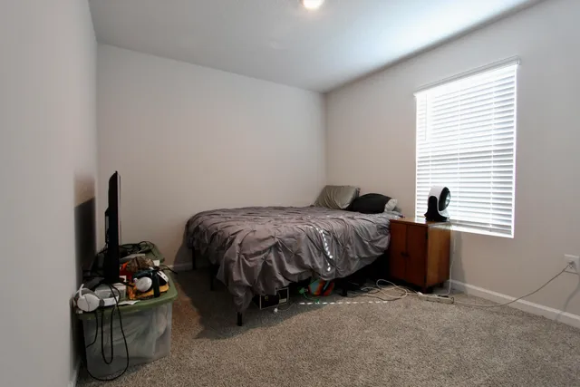 a bedroom with a bed and a closet