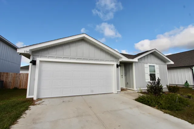 a view of garage and yard