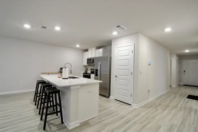 a view of kitchen with wooden floor