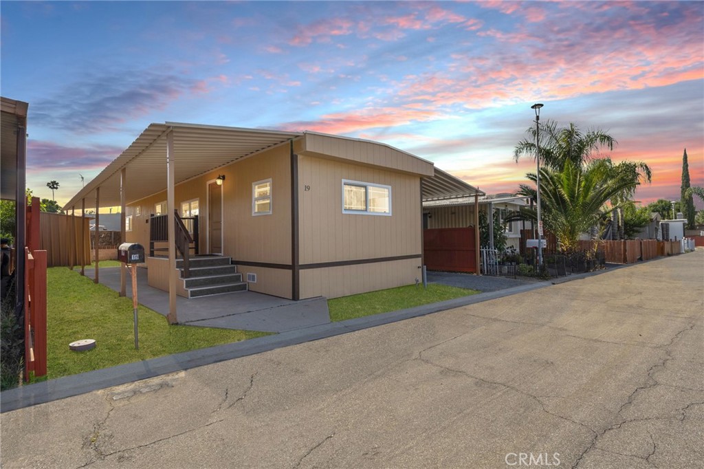 2250 West Mill Street, Unit 19 Colton, CA 92324 - Photo 1 of 27 a view of a house with a yard