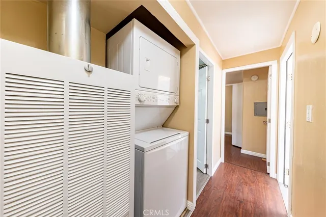 a view of a hallway with a white wooden cabinets