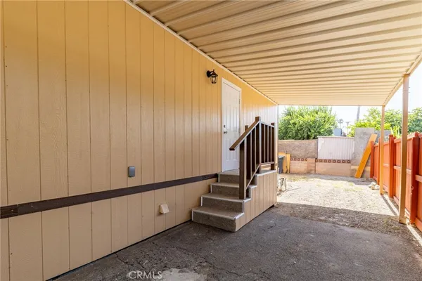 a view of an outdoor space with wooden fence