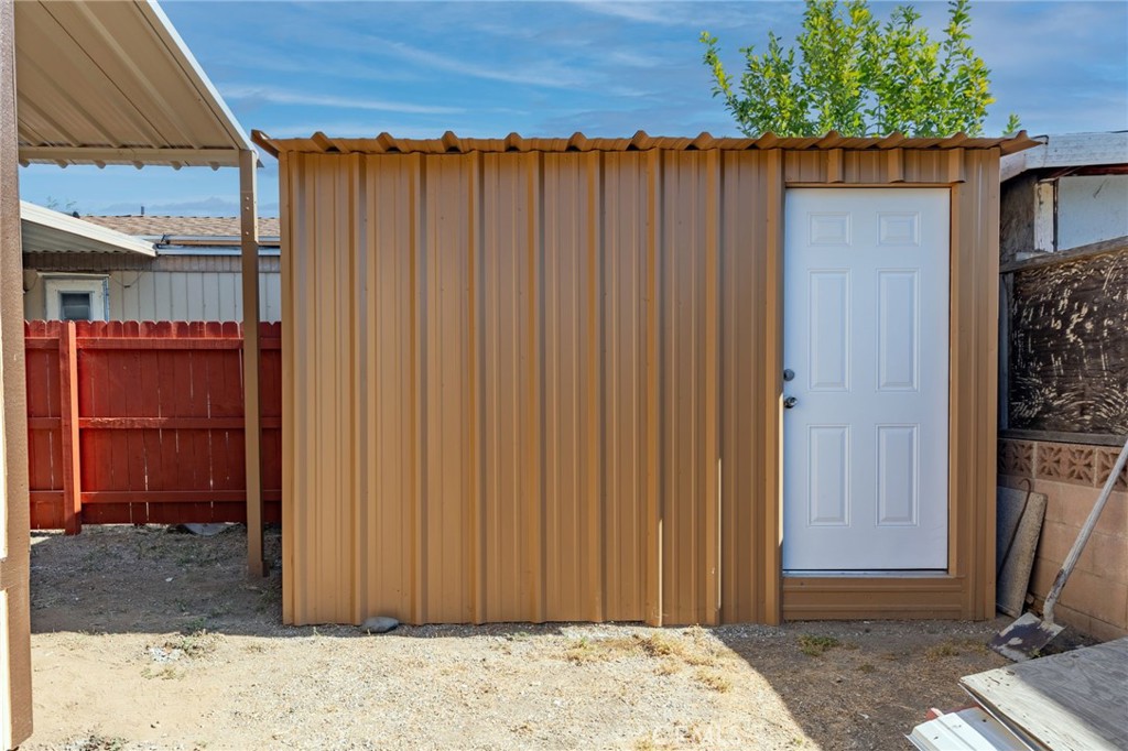 2250 West Mill Street, Unit 19 Colton, CA 92324 - Photo 25 of 27 a view of a backyard with a small cabin