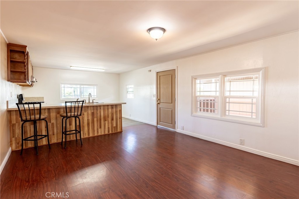 2250 West Mill Street, Unit 19 Colton, CA 92324 - Photo 3 of 27 a view of a kitchen with furniture and wooden floor