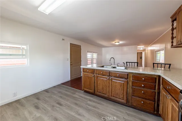 a kitchen with sink and cabinets