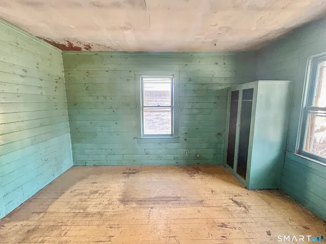 a bathroom with a sink toilet and mirror