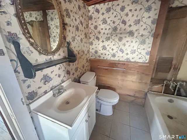 a bathroom with a toilet and shower