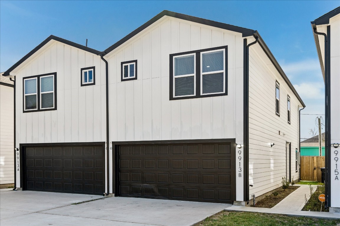 a front view of a house with garage
