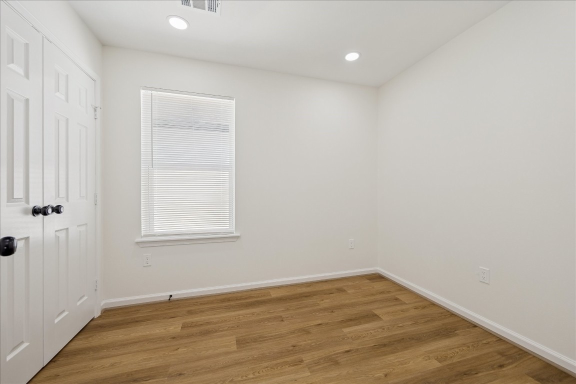 9913 Porto Rico Road Houston, TX 77041 - Photo 29 of 34 an empty room with wooden floor and windows