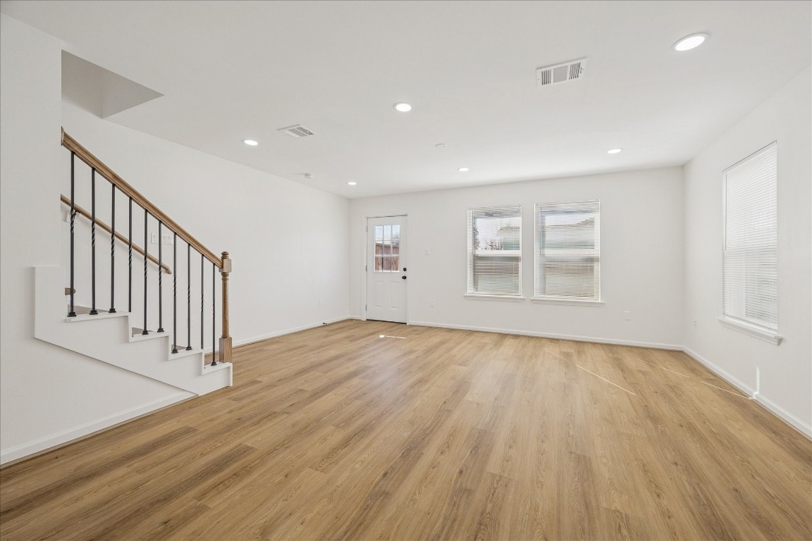 9913 Porto Rico Road Houston, TX 77041 - Photo 7 of 34 wooden floor in an empty room with a window