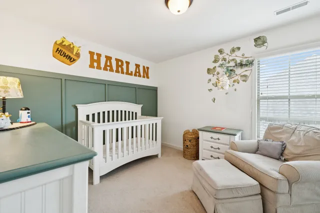 a bedroom with furniture and a window