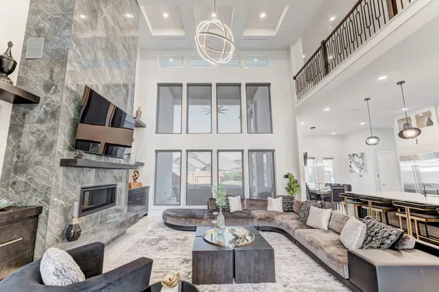 a living room with furniture fireplace and flat screen tv
