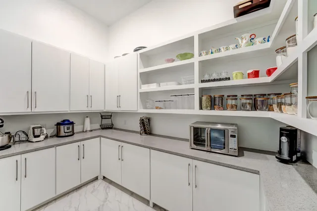 a kitchen with stainless steel appliances a cabinets and a counter top space