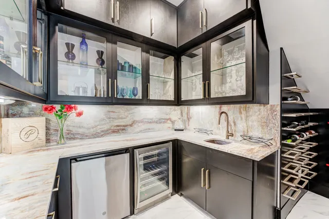 a kitchen with a sink and cabinets