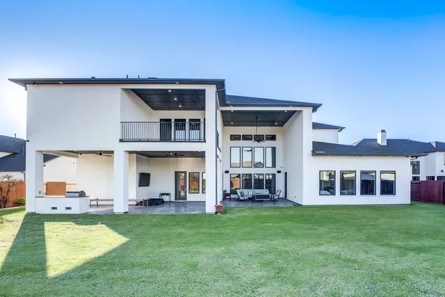 a view of an house with backyard porch and furniture