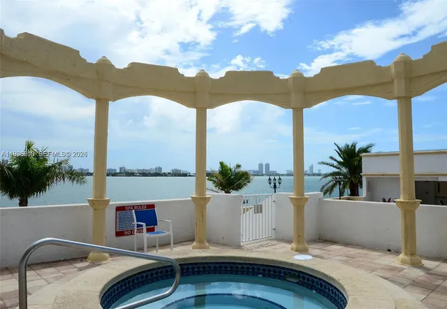 a view of balcony with furniture