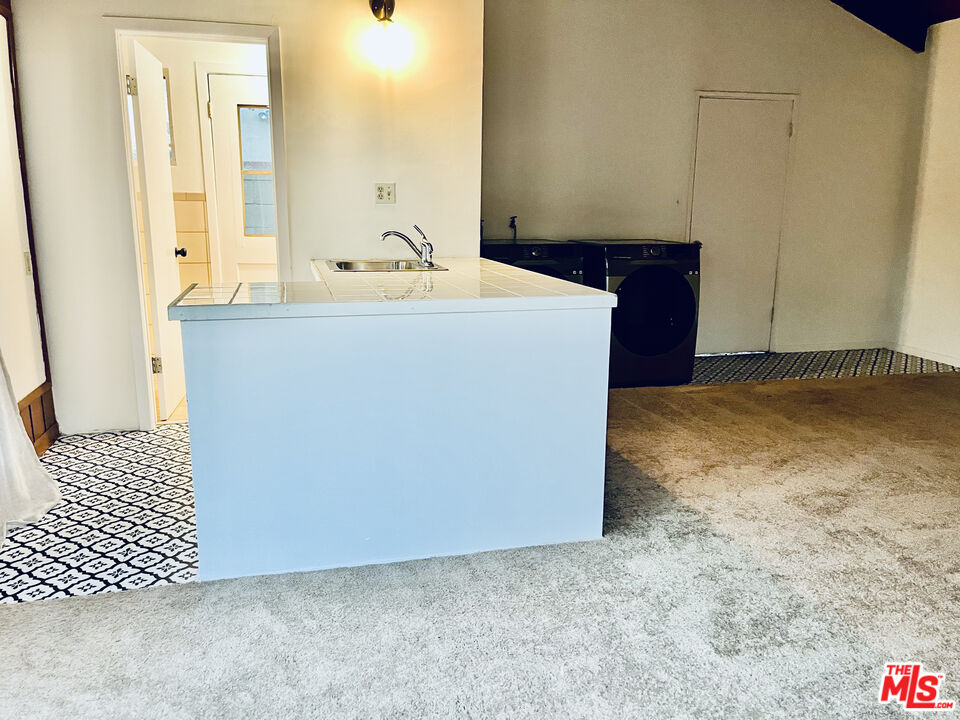 4675 Laurelgrove Avenue Studio City, CA 91604 - Photo 13 of 15 a bathroom with a sink and a mirror