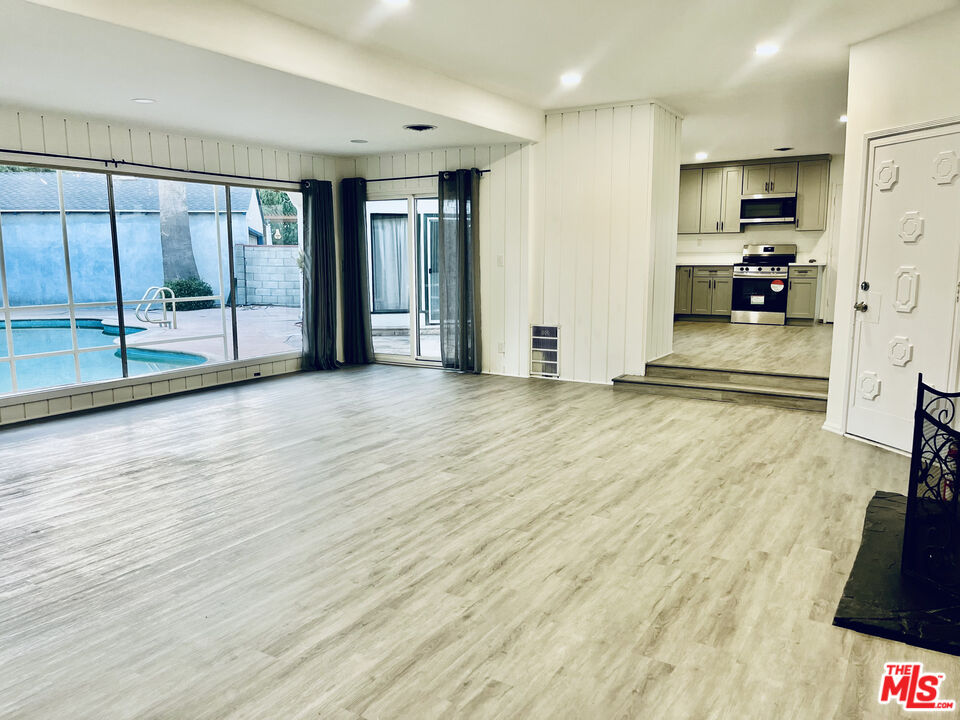 4675 Laurelgrove Avenue Studio City, CA 91604 - Photo 7 of 15 a view of a kitchen with a sink and a refrigerator