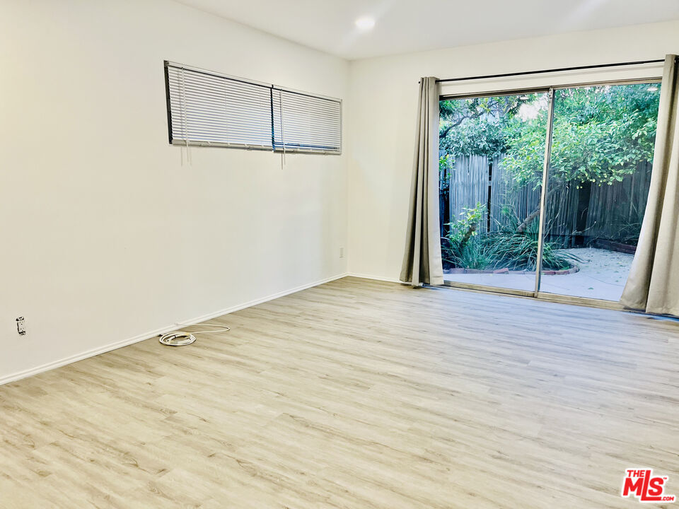 4675 Laurelgrove Avenue Studio City, CA 91604 - Photo 10 of 15 a view of a room with wooden floor and wooden floor