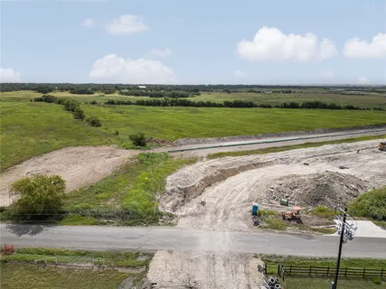 a view of a lake with a big yard
