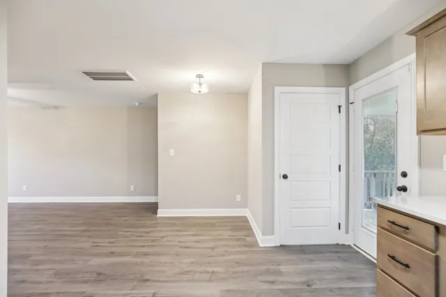 a view of cabinets and wooden floor