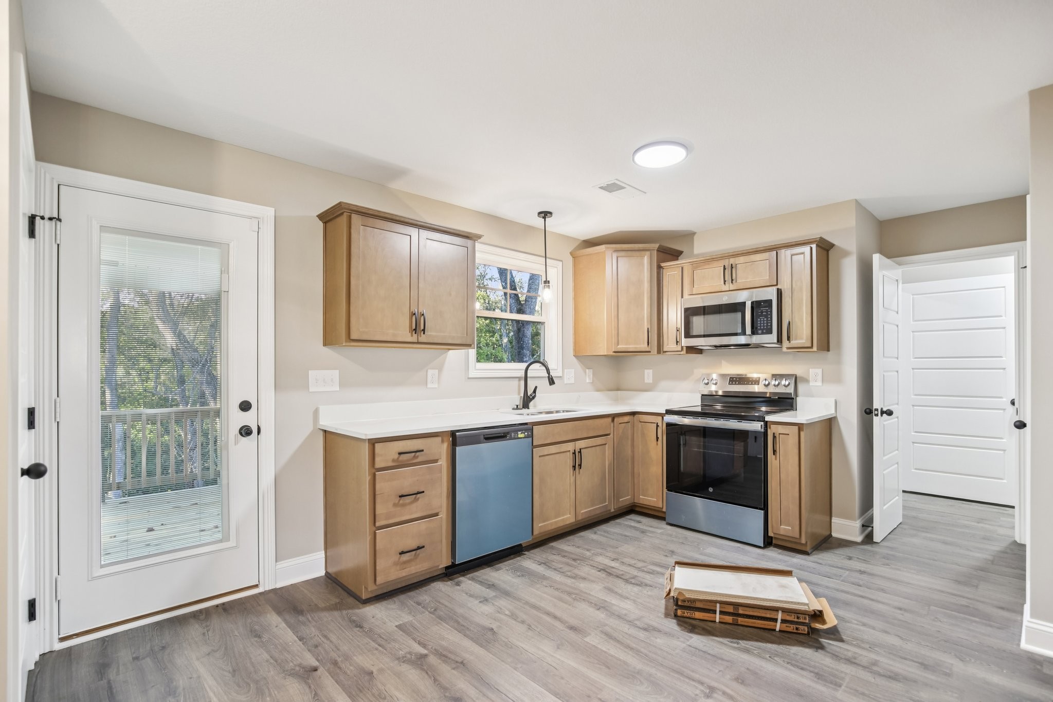 1288 Racker Drive Clarksville, TN 37043 - Photo 12 of 49 a kitchen with stainless steel appliances granite countertop a stove a sink and a refrigerator