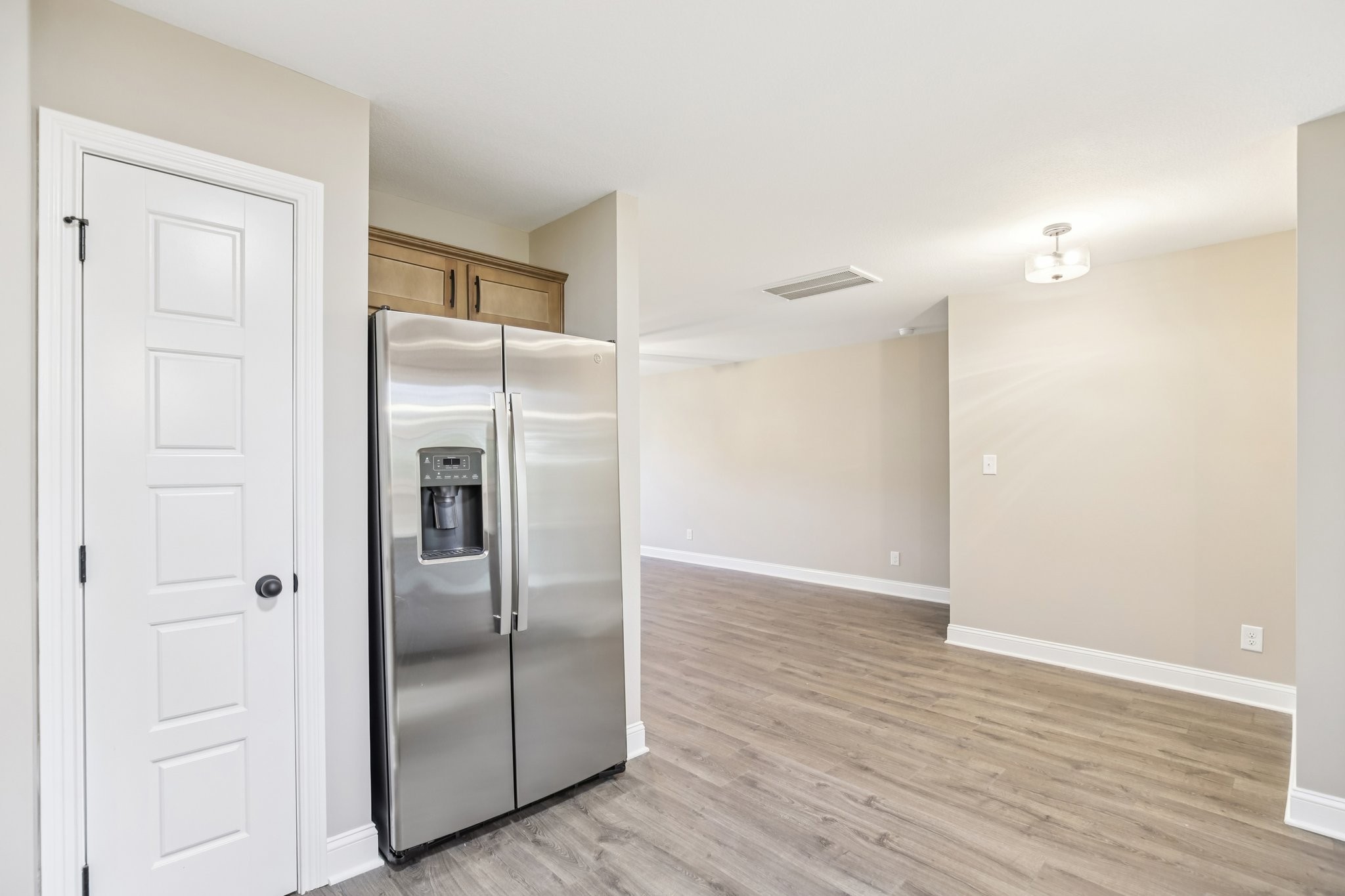 1288 Racker Drive Clarksville, TN 37043 - Photo 17 of 49 a view of a refrigerator in kitchen and wooden floor